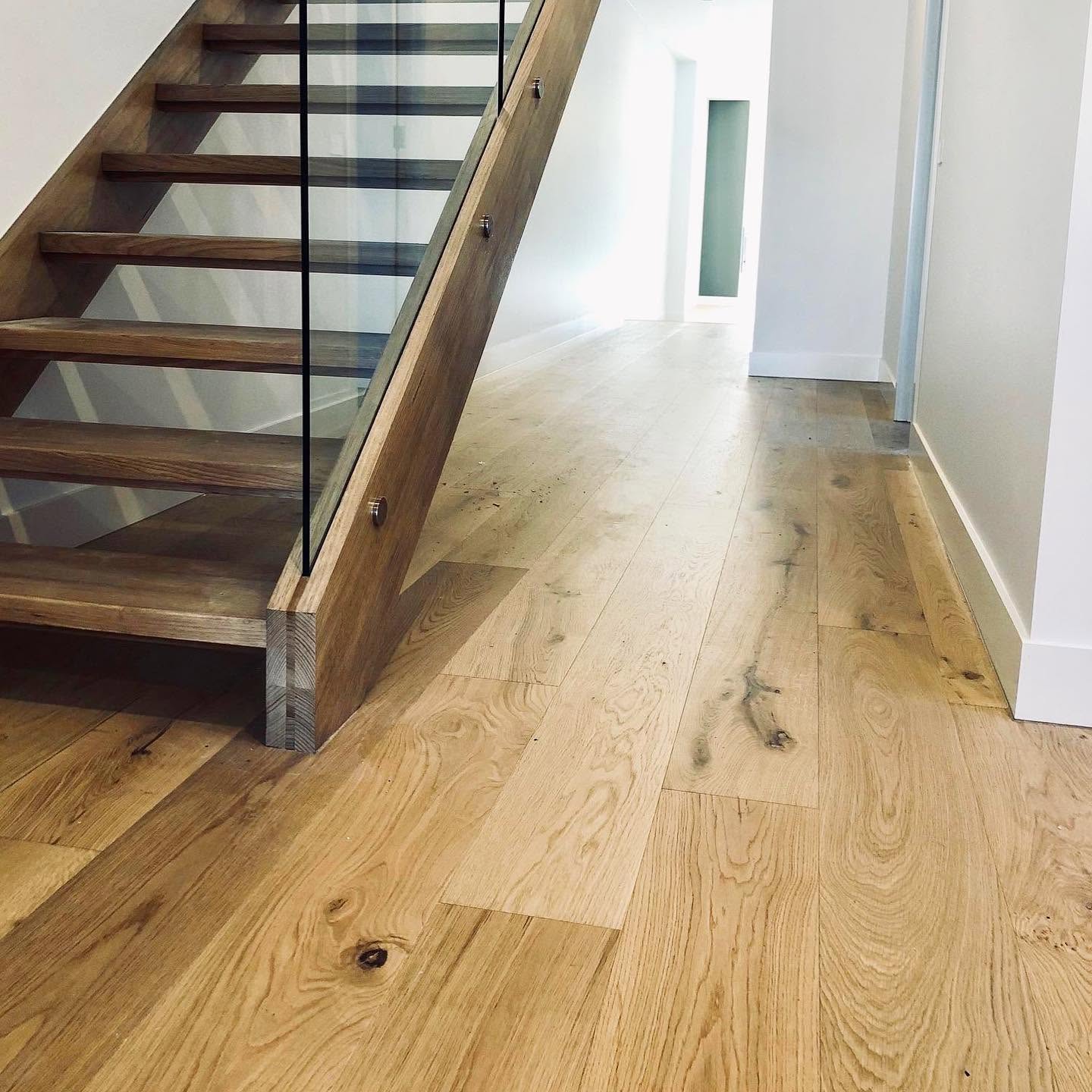 Wide board oak floor through a Melbourne kitchen and dining space